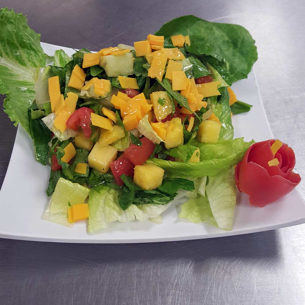 Garden salad with mango and pineapple