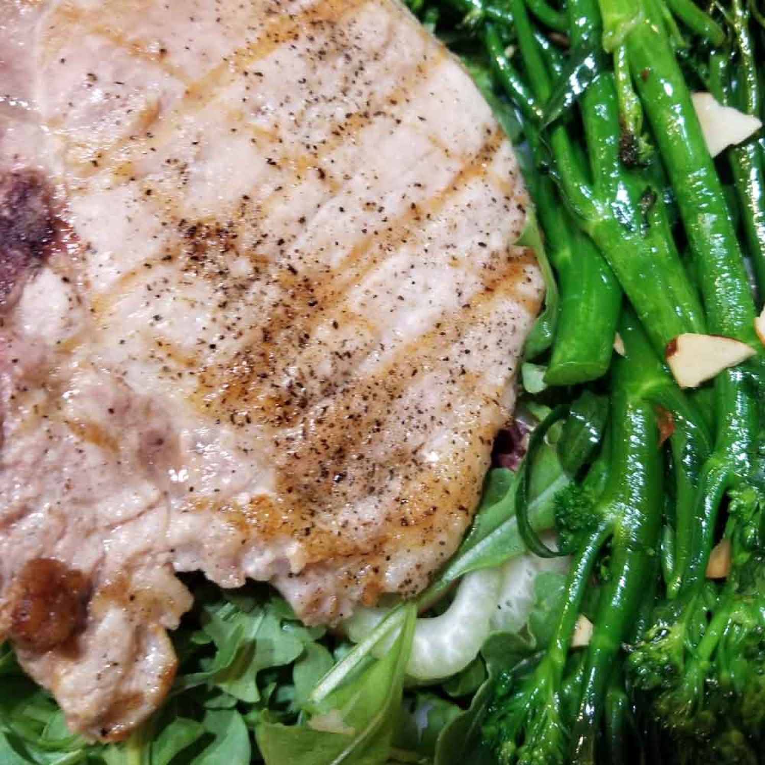 Pork tenderloin on apple salad with roasted broccolini